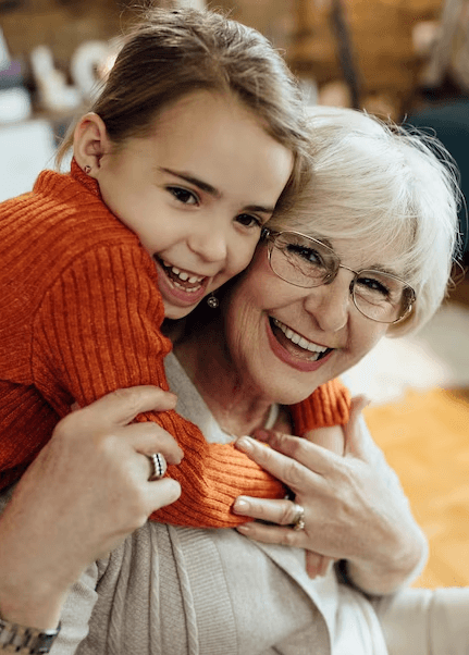 Young girl holding her grandmother